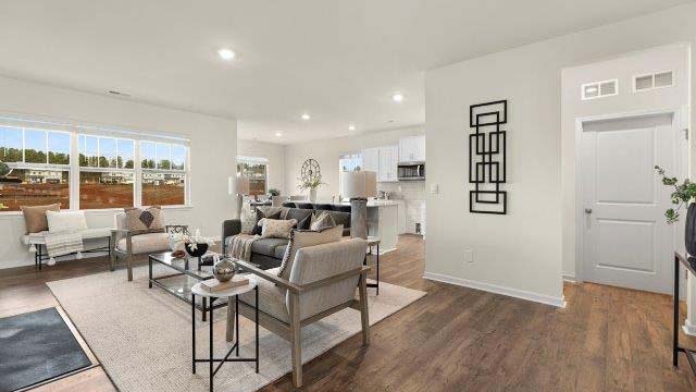 Open family room with large windows, and fireplace