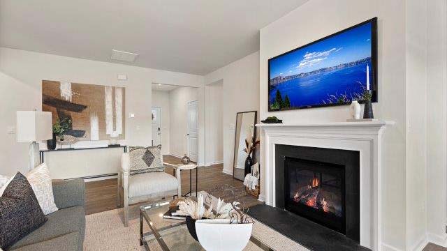 Open family room with large windows, and fireplace