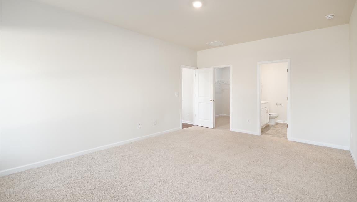 Primary bathroom with double sinks, and bathtub