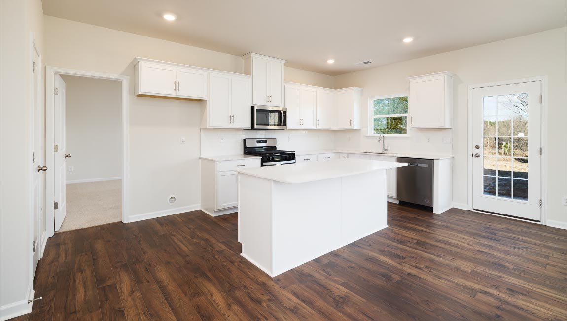 Kitchen and island with white counters and cabinets