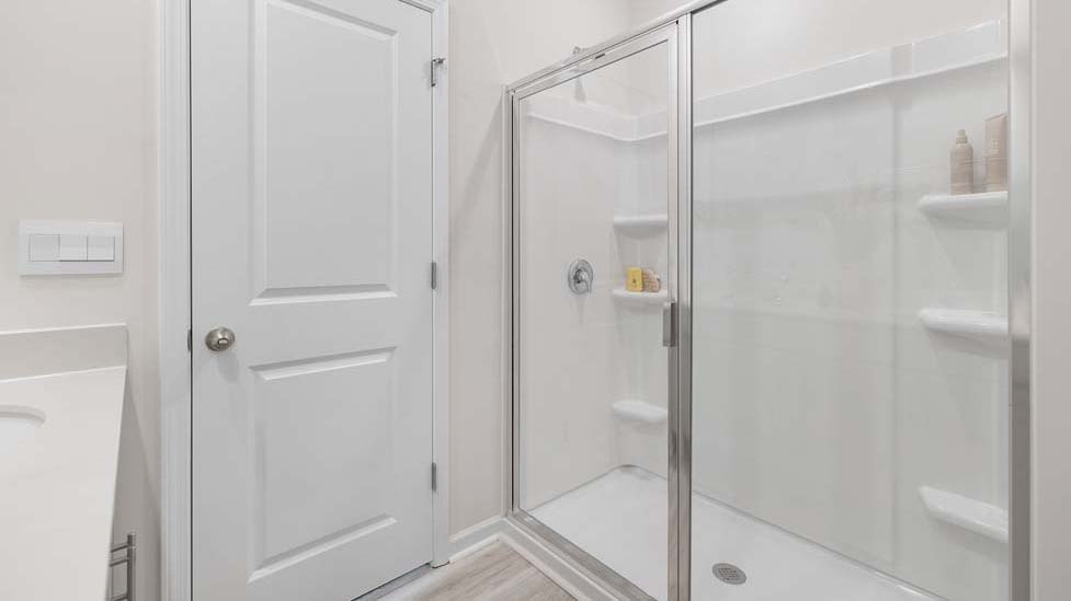 Primary bathroom with double sinks, and bathtub