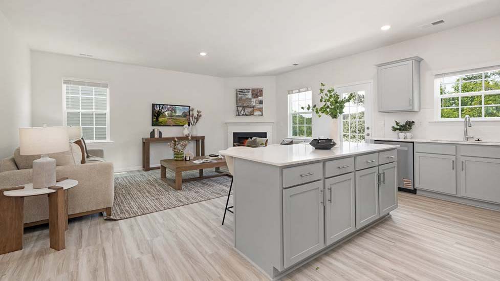 Kitchen and island with white counters and cabinets