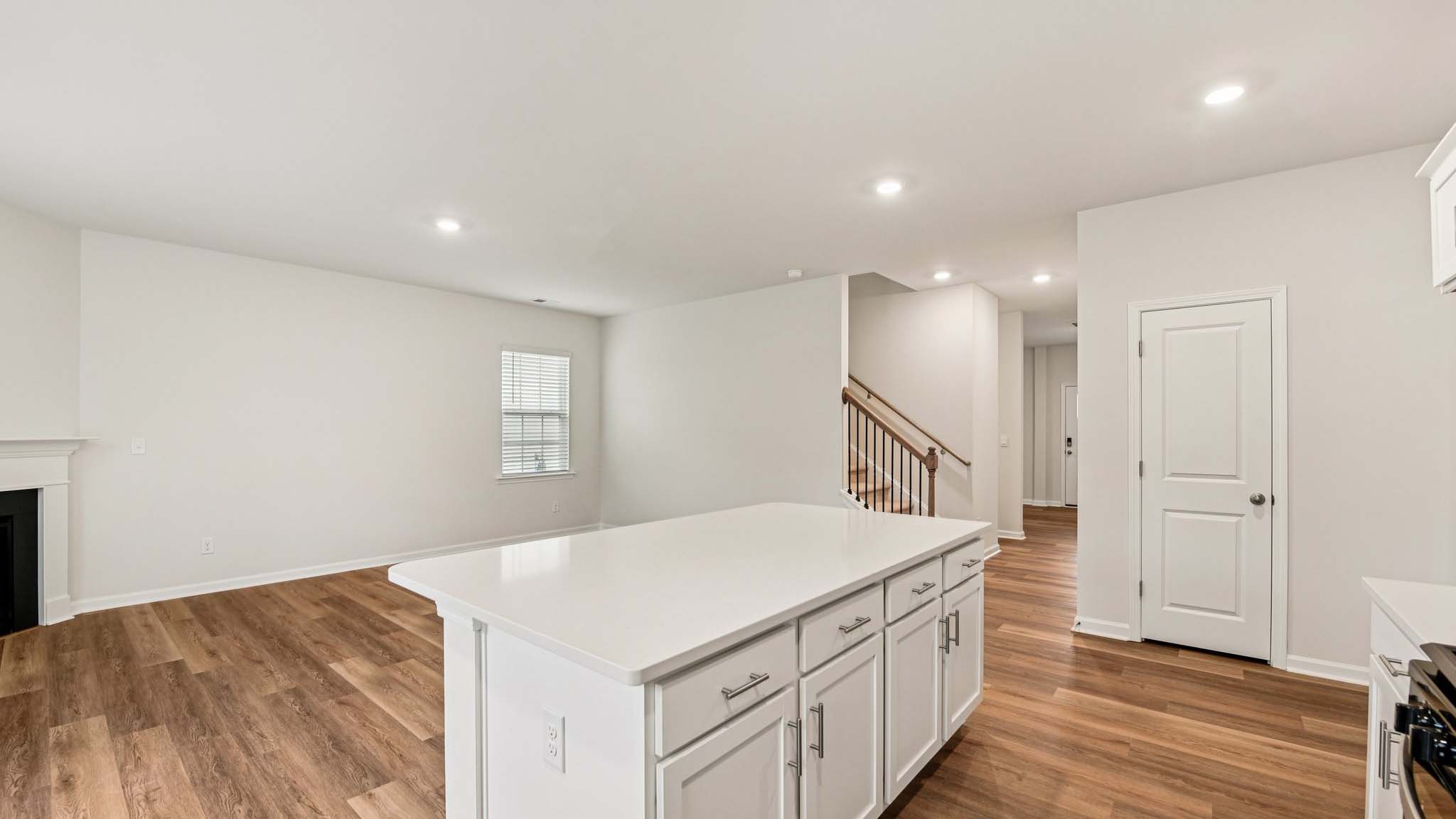 Kitchen and island with stainless steel appliances