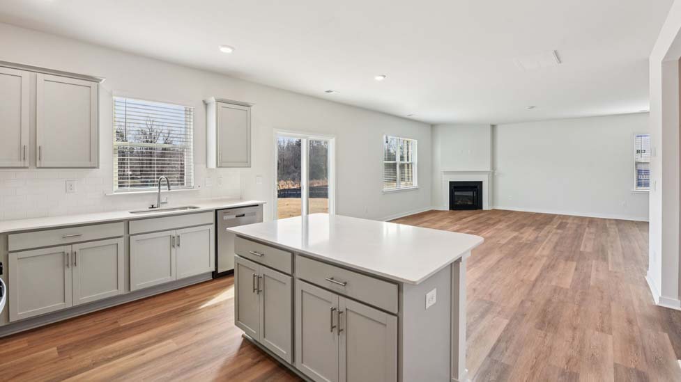 Kitchen and island with stainless steel appliances