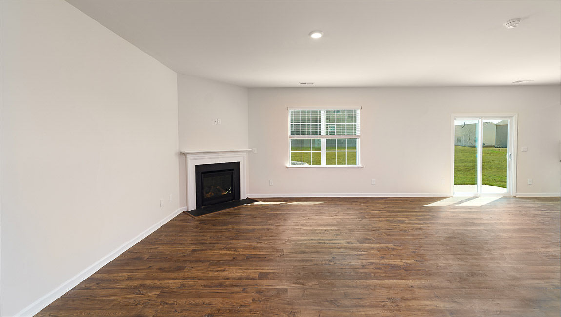 Living room with fireplace and large window
