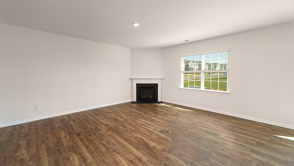 Living room with fireplace and large window