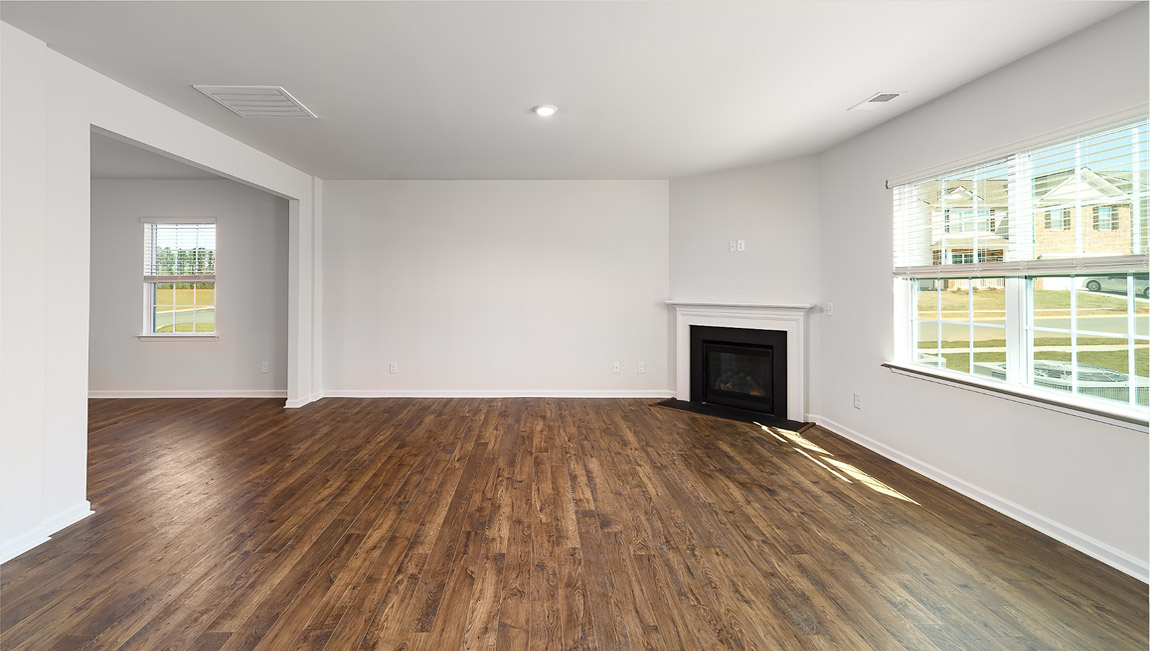 Living room with fireplace and large window