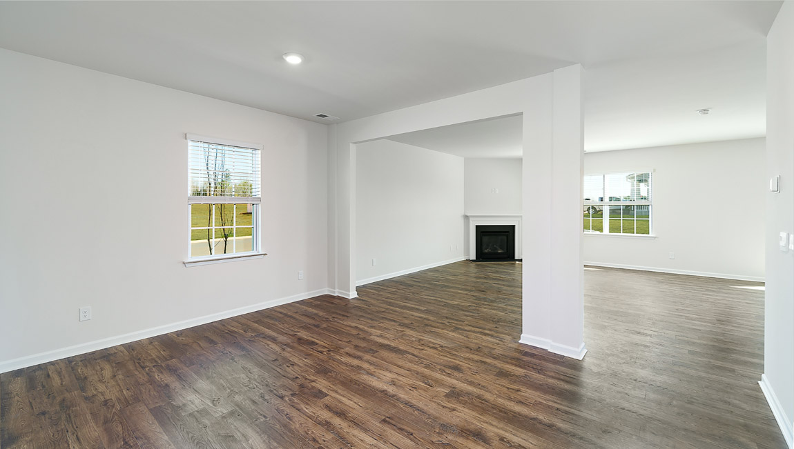 Dining room area with small window and view of living room