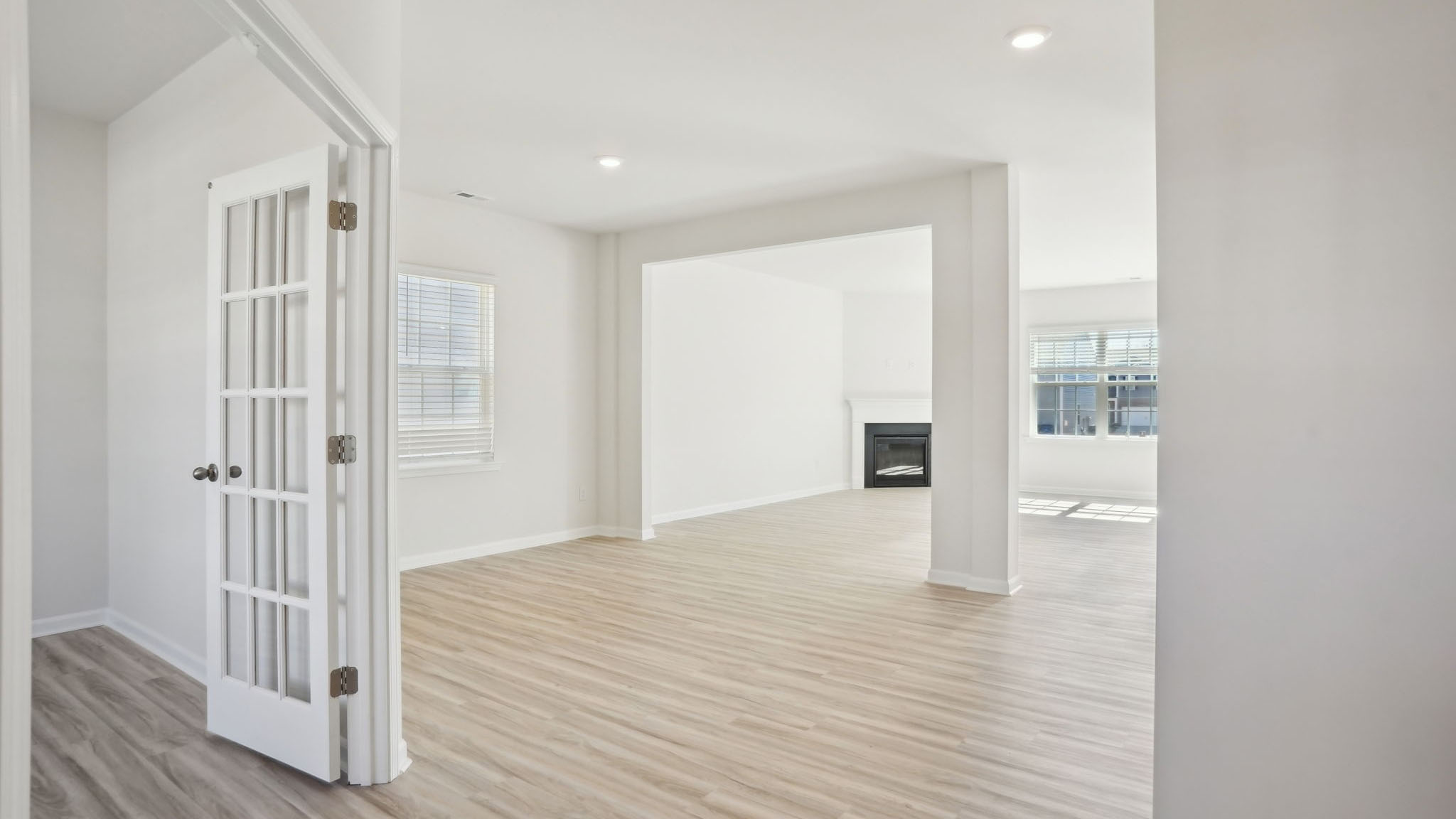 Dining room area with small window and view of living room
