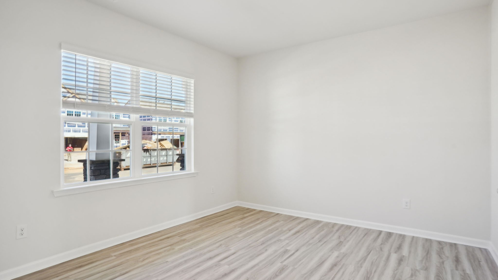Carpeted bedroom with small windows