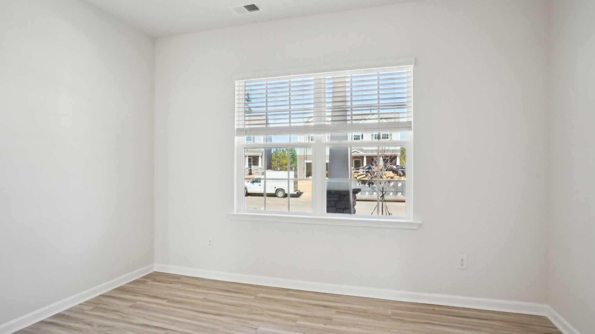 Carpeted bedroom with small windows