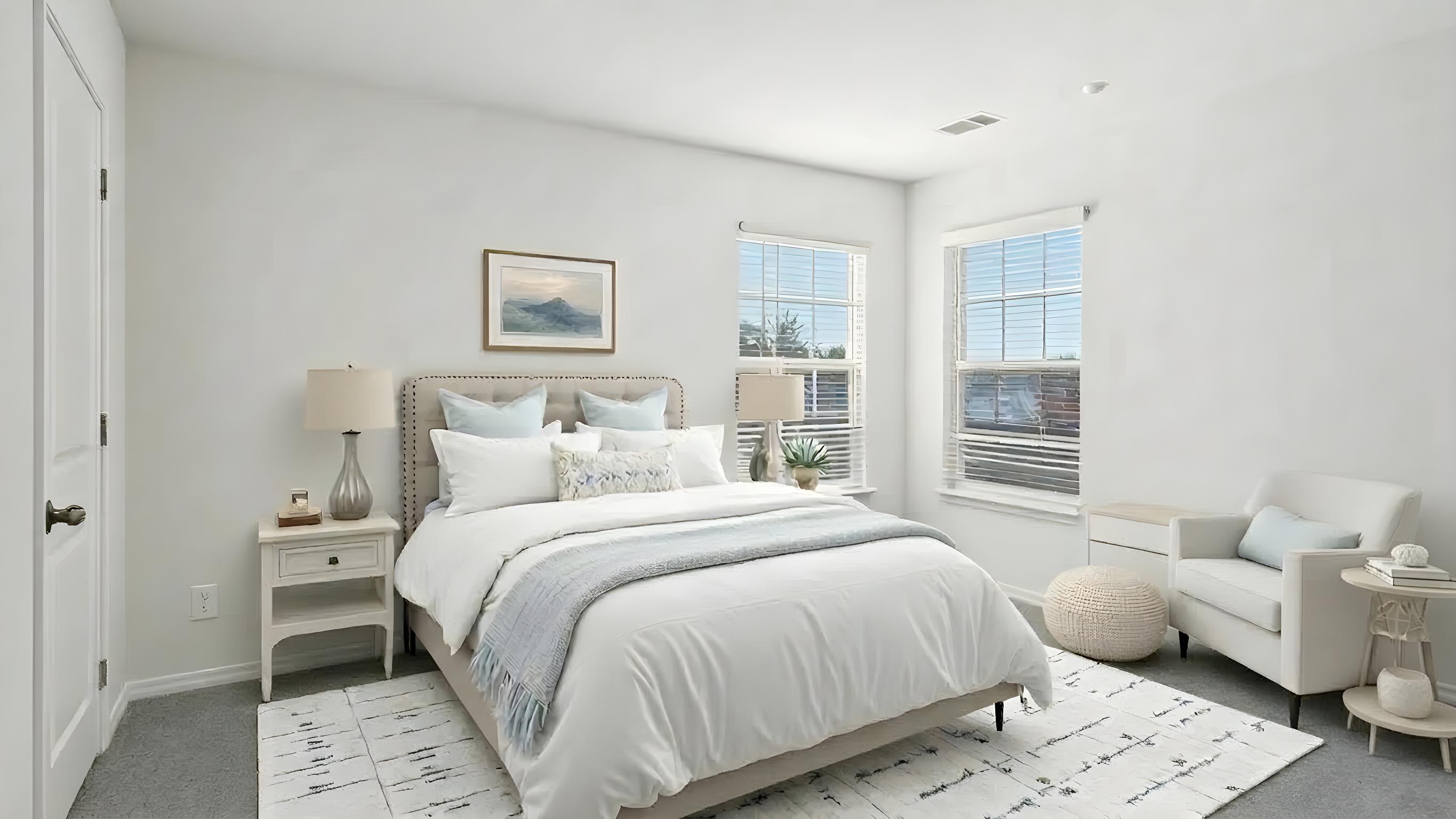 Carpeted bedroom with small windows