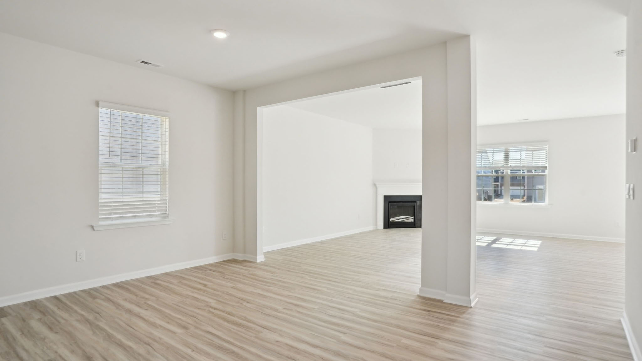 Living room with fireplace and large window