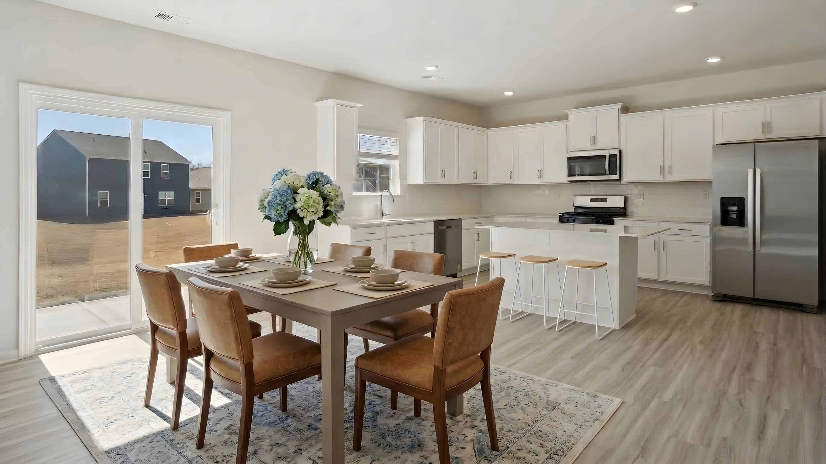 Kitchen and breakfast area with sliding glass back door