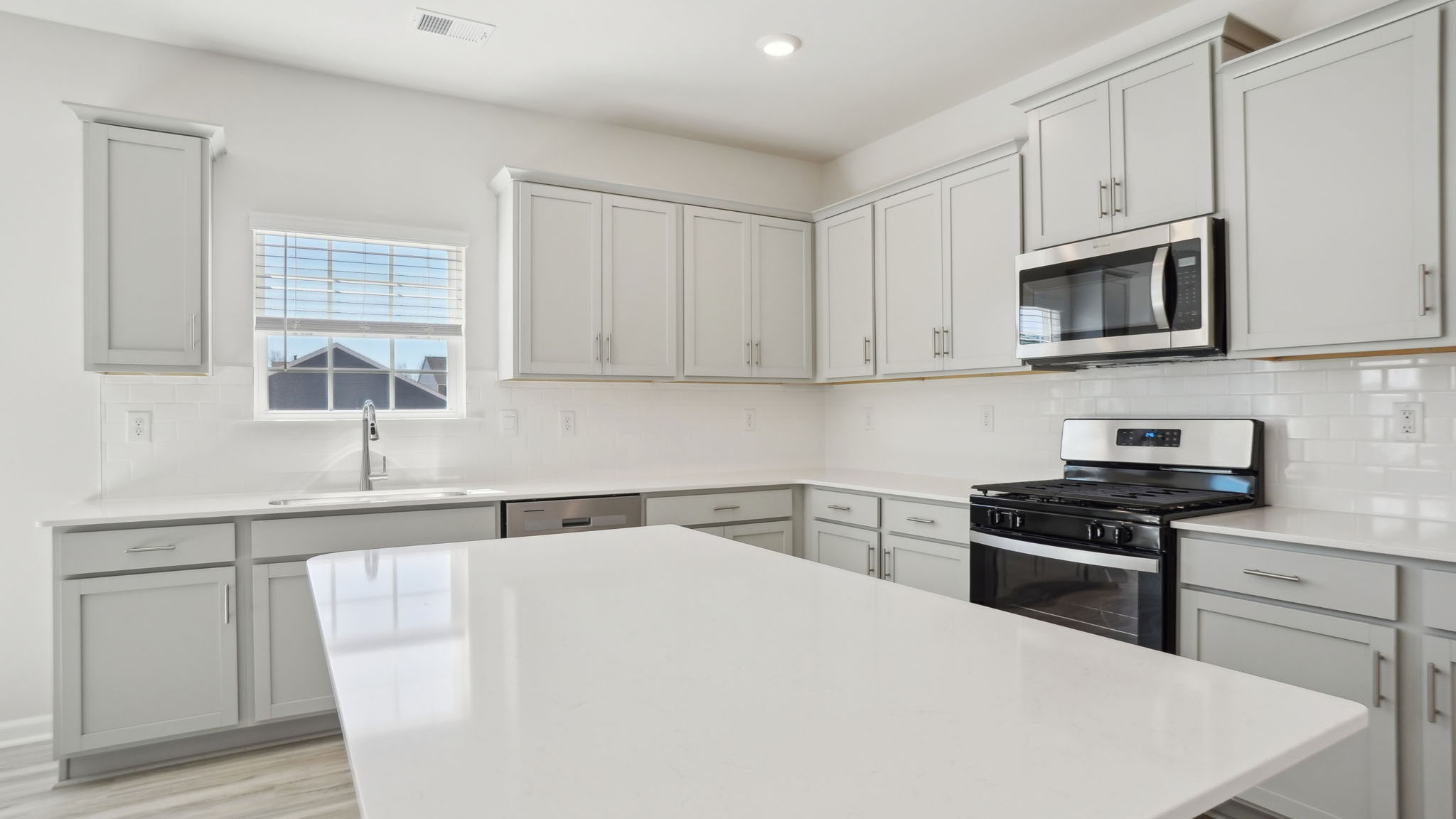 Kitchen and breakfast area with sliding glass back door