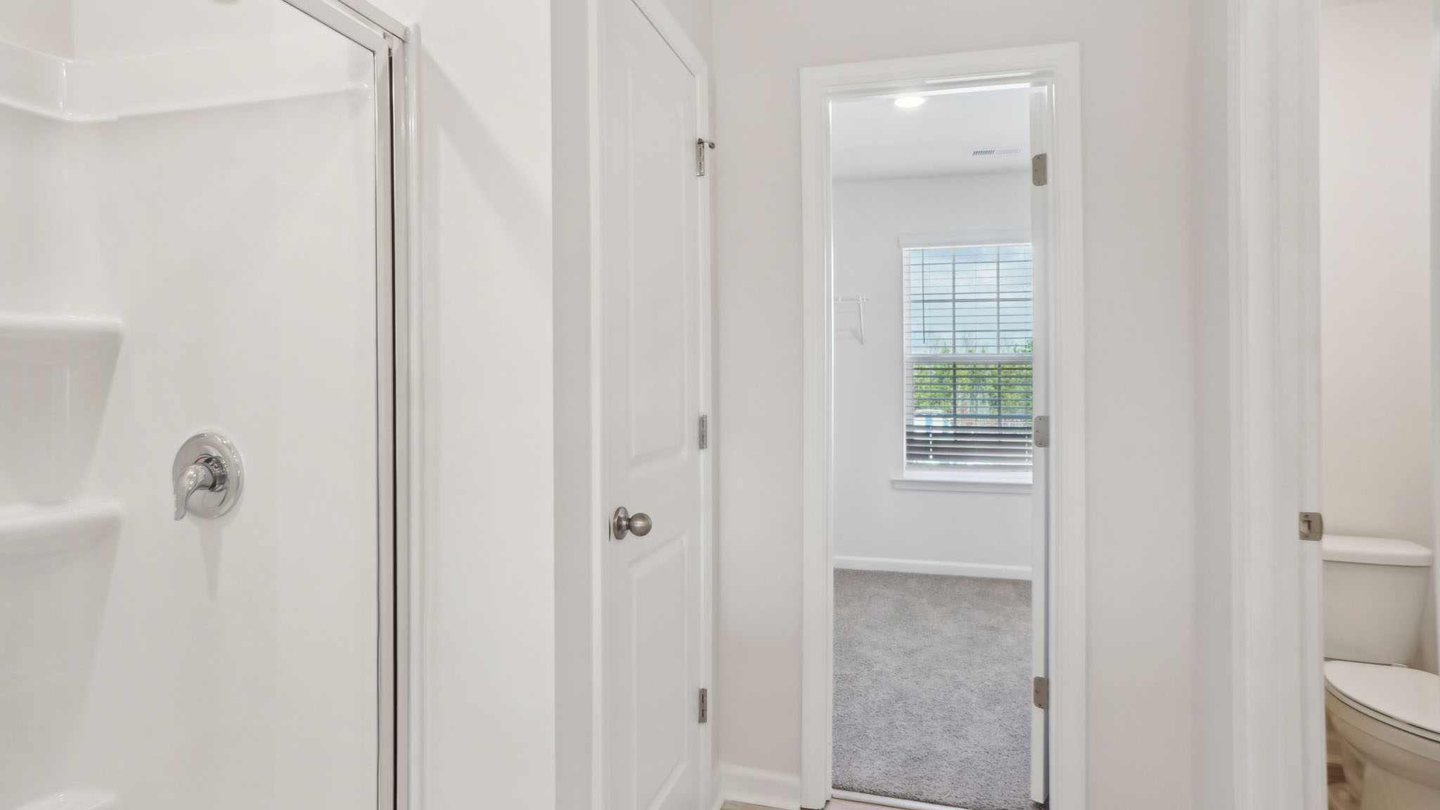 Carpeted bedroom with small windows