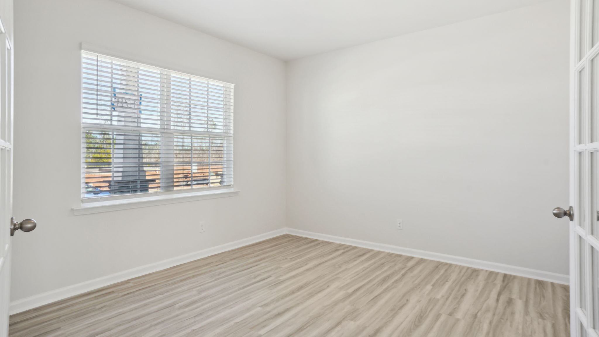 Study with french doors and large window