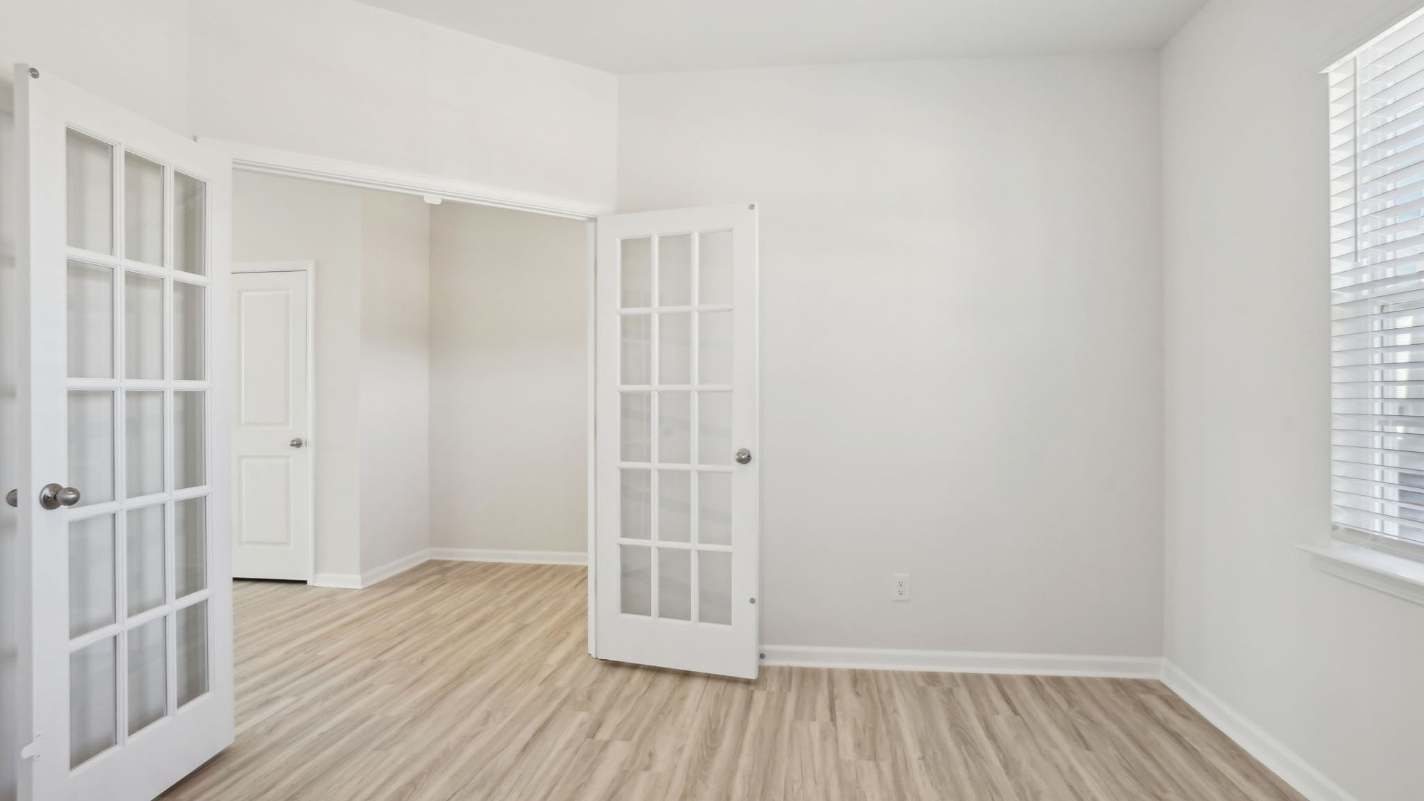 Study with french doors and large window