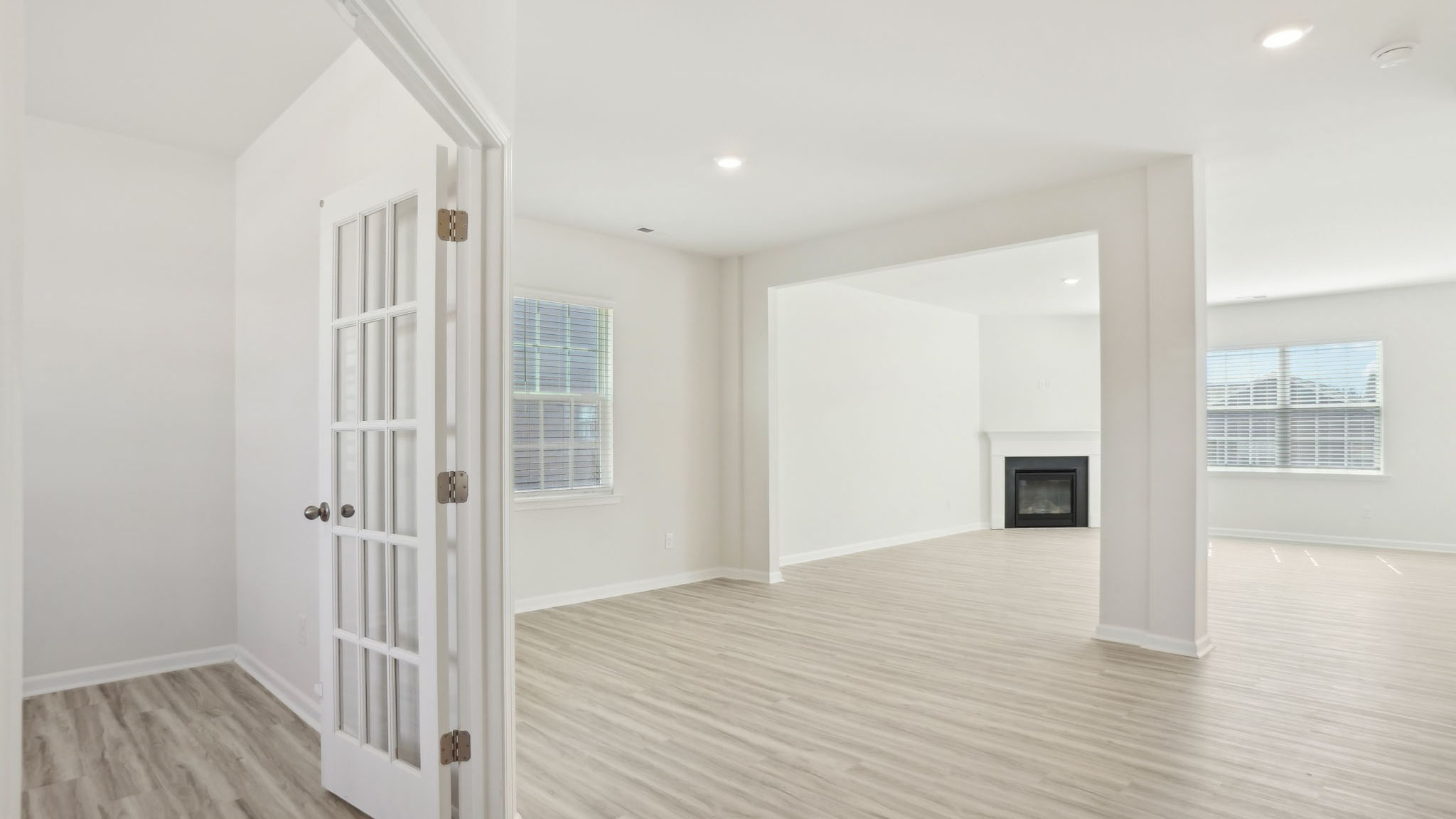Welcoming foyer with view of flex room, dining and living room