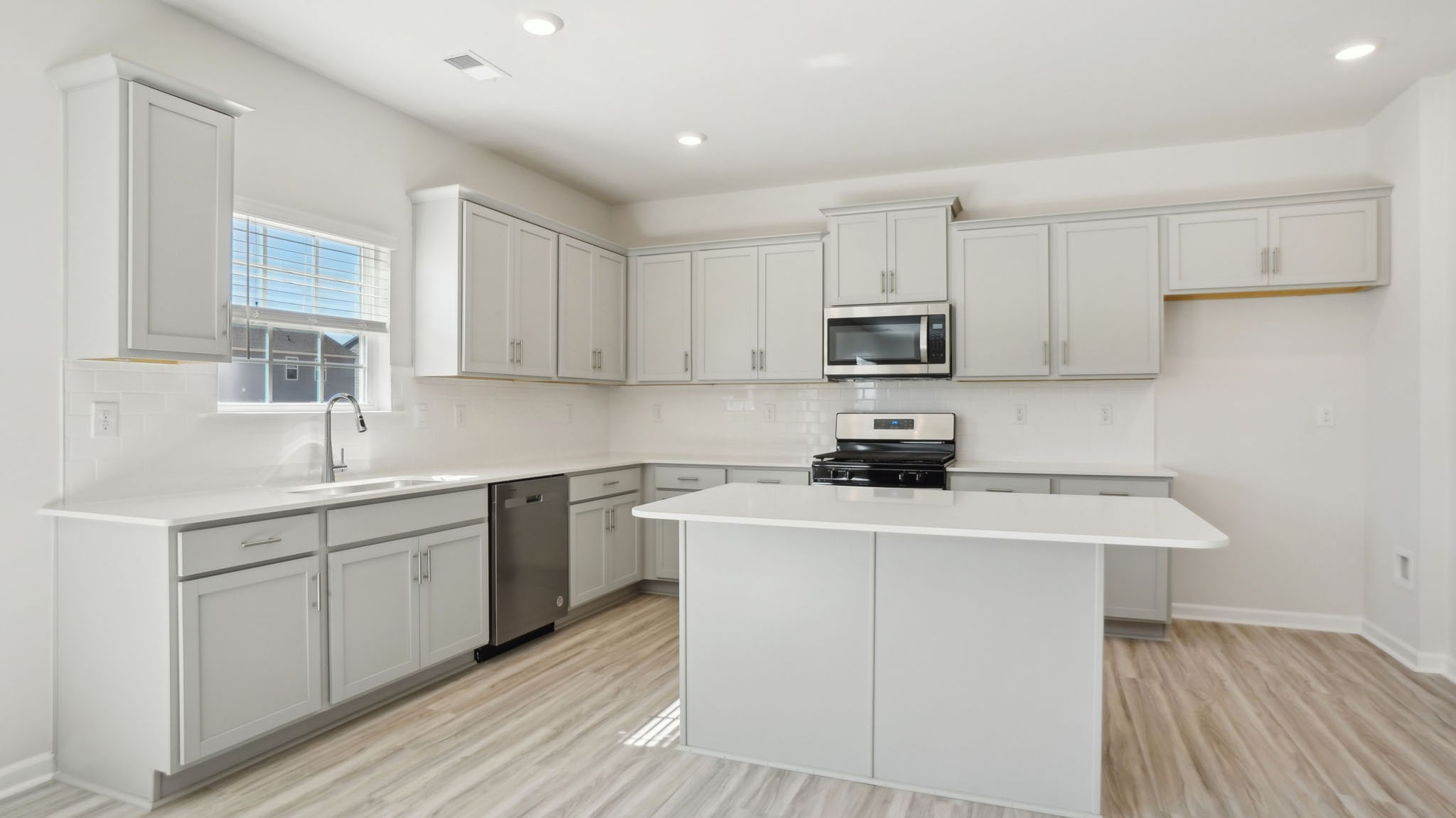 Kitchen and breakfast area with sliding glass back door