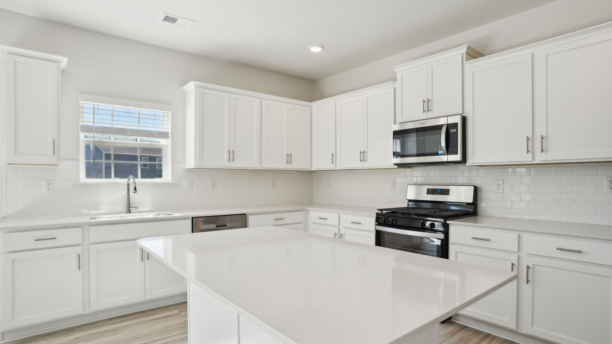 Kitchen and breakfast area with sliding glass back door
