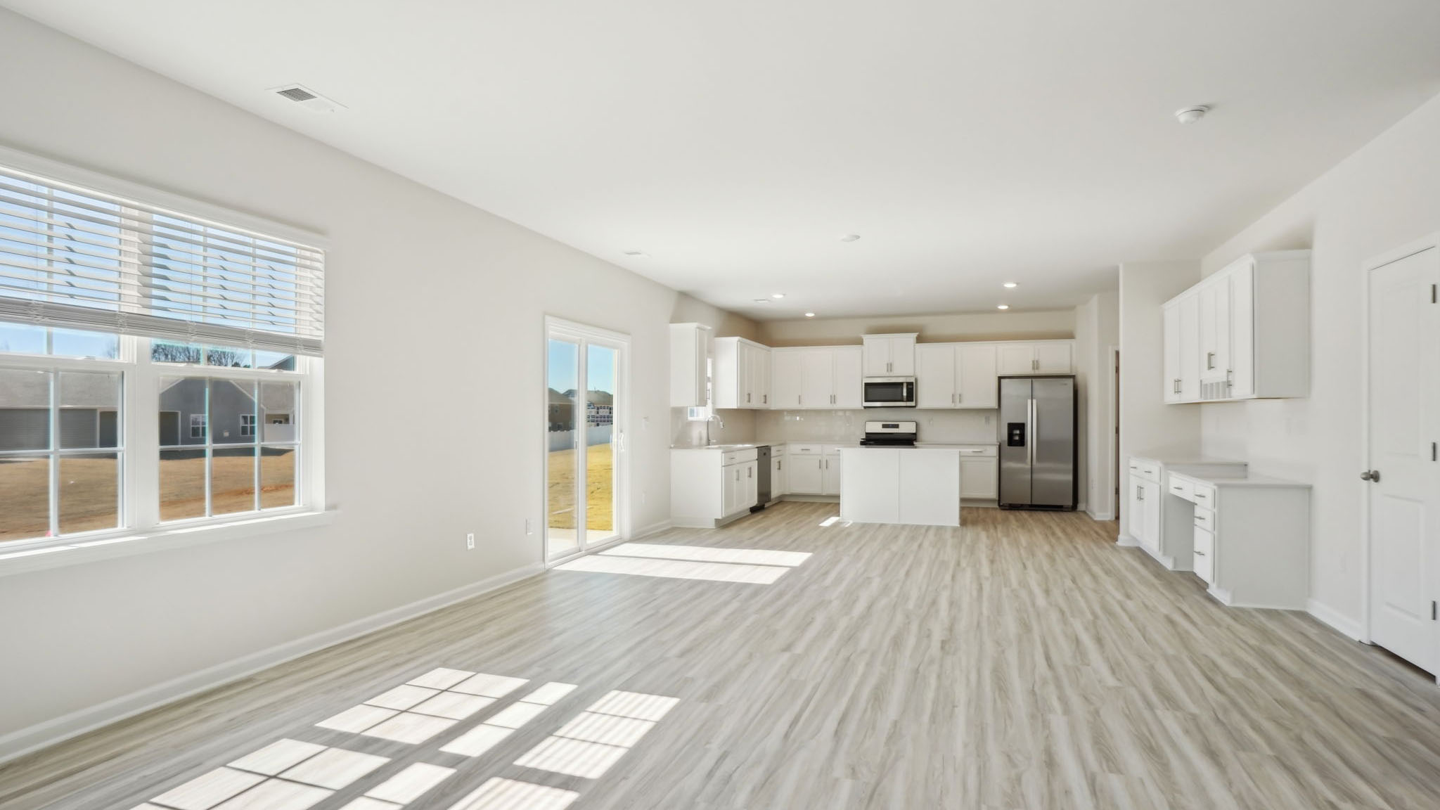 Living room with fireplace and large window