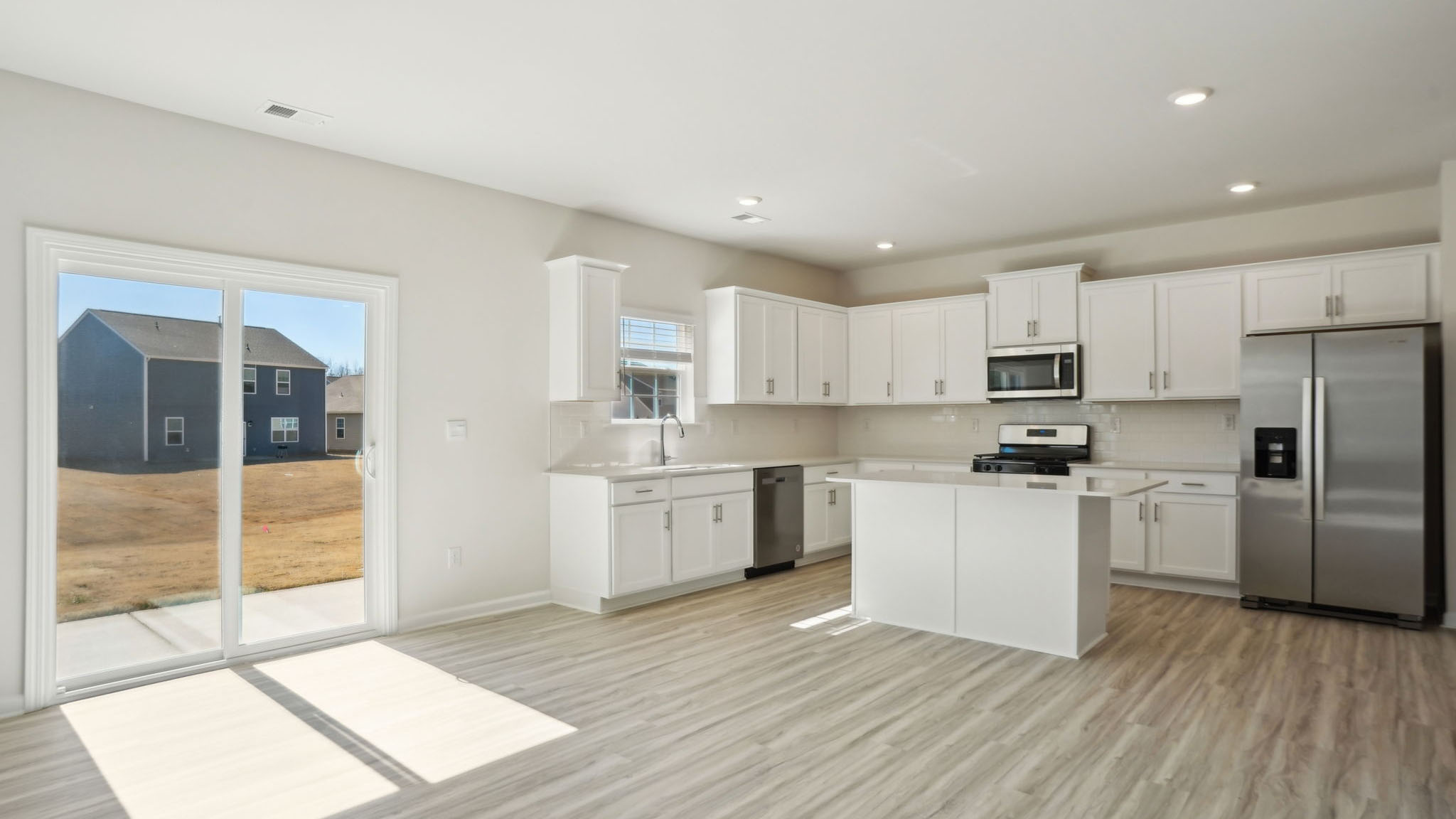 Kitchen and breakfast area with sliding glass back door