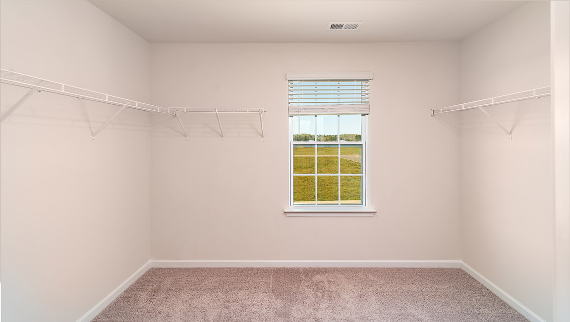 Carpeted walk in closet