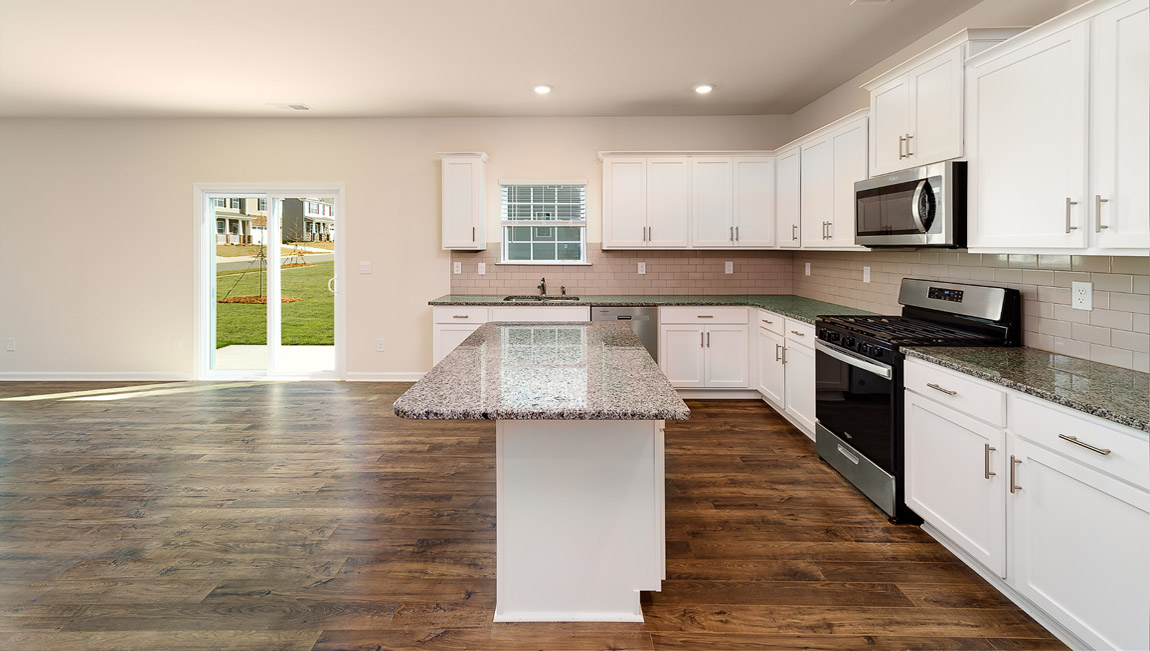 Kitchen and breakfast area with sliding glass back door