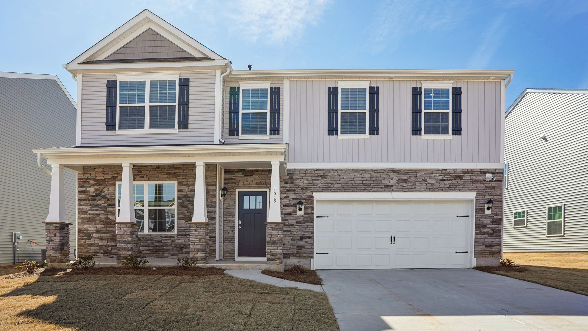 Columbia front exterior with stone and two car garage