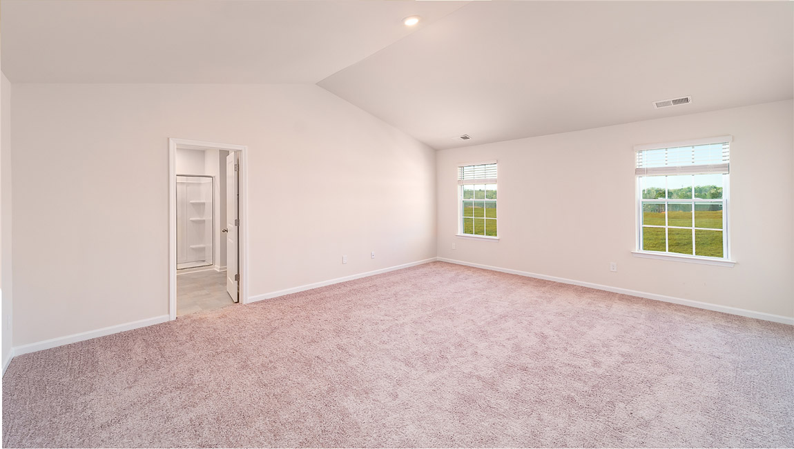 Carpeted bedroom with small windows