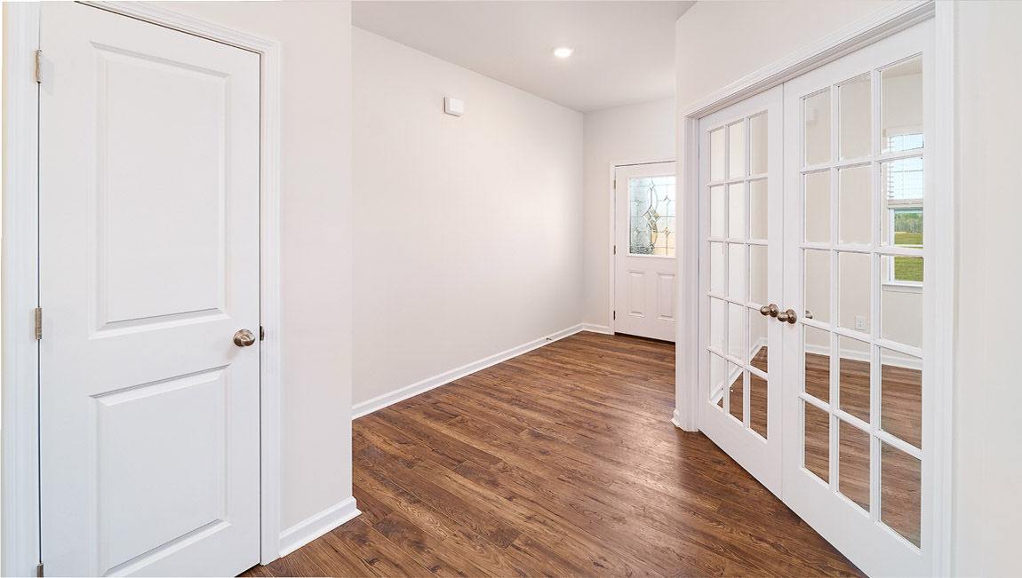 Welcoming foyer with view of flex room, dining and living room