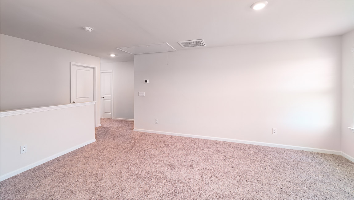 Upstairs carpeted loft