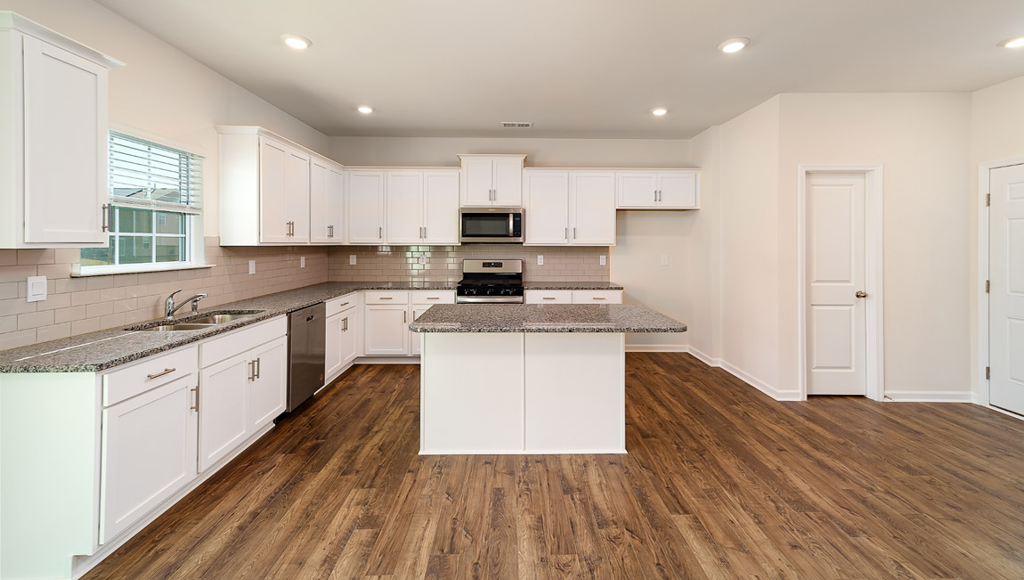 Kitchen and breakfast area with sliding glass back door