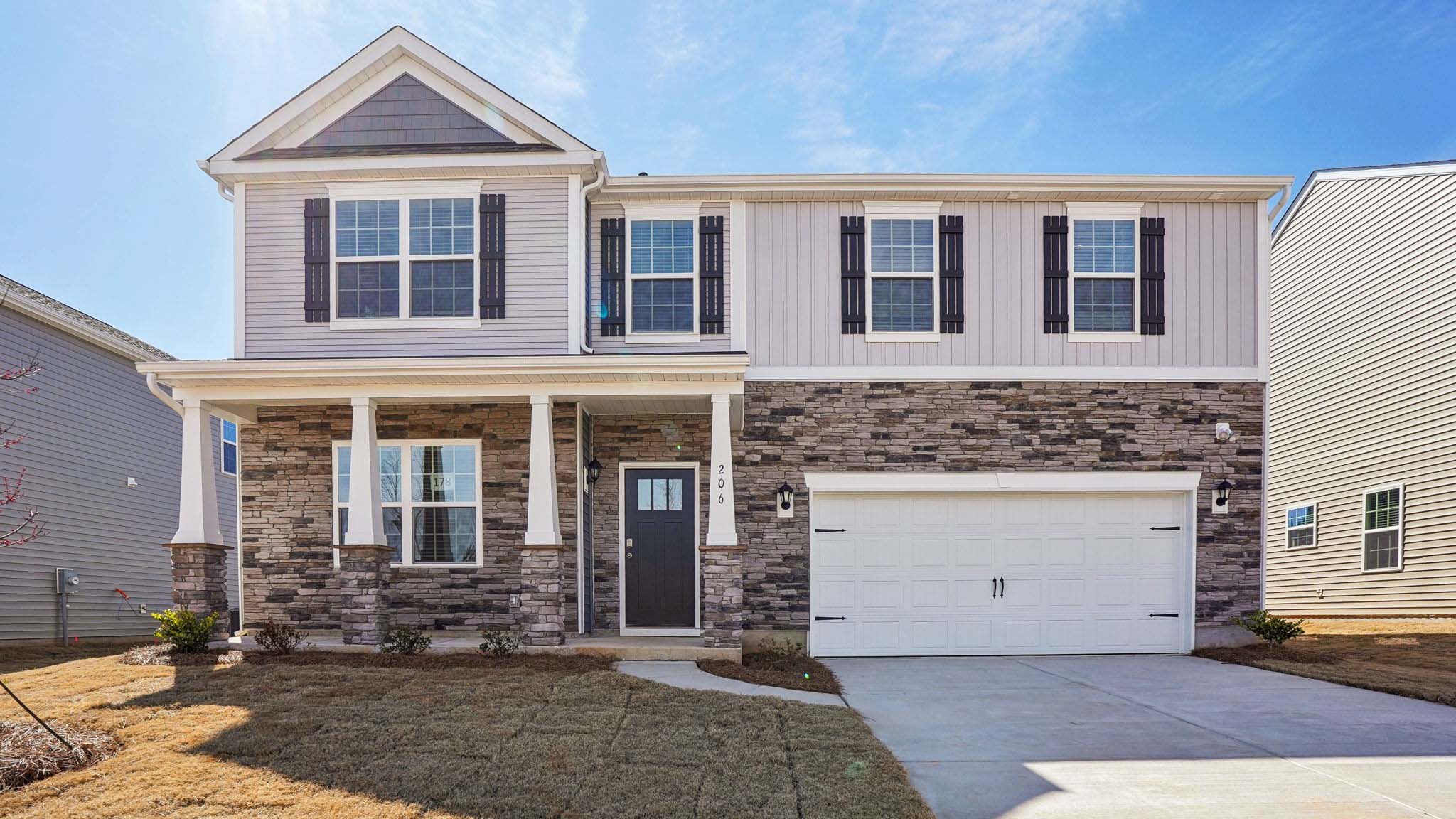 Columbia front exterior with stone and two car garage