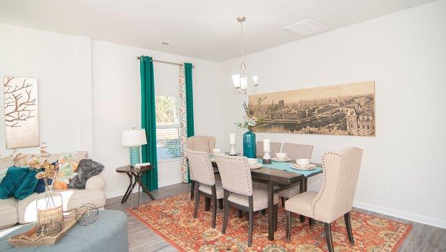 Spacious family room with large window and fireplace