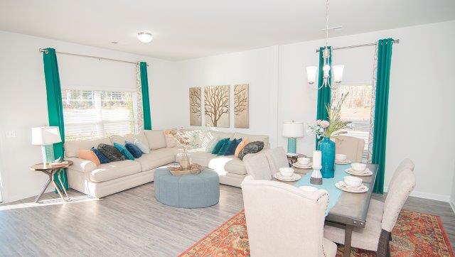 Spacious family room with large window and fireplace