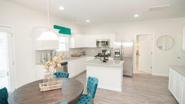 Kitchen with island, white cabinets