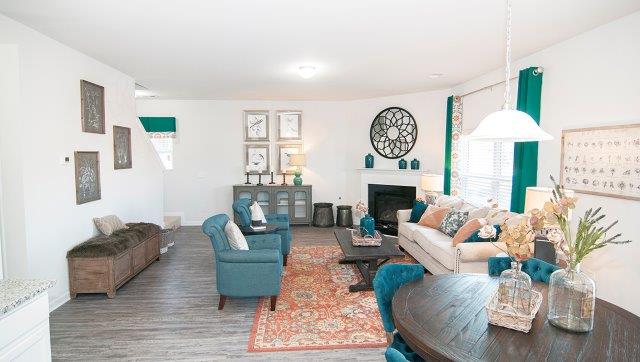 Spacious family room with large window and fireplace