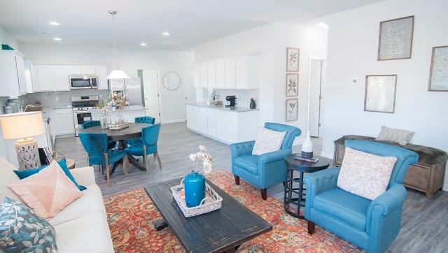 Spacious family room with large window and fireplace