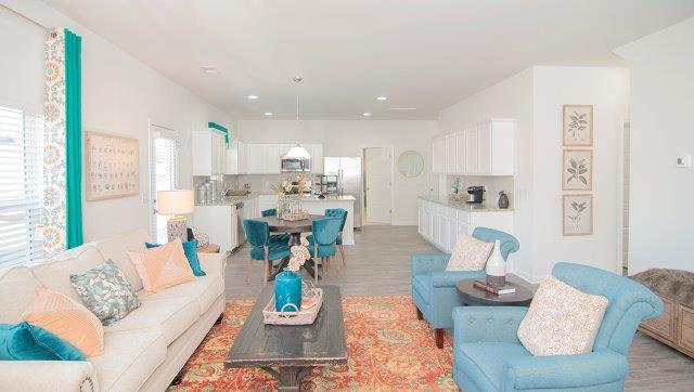 Spacious family room with large window and fireplace