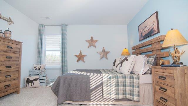 Carpeted bedroom with large window