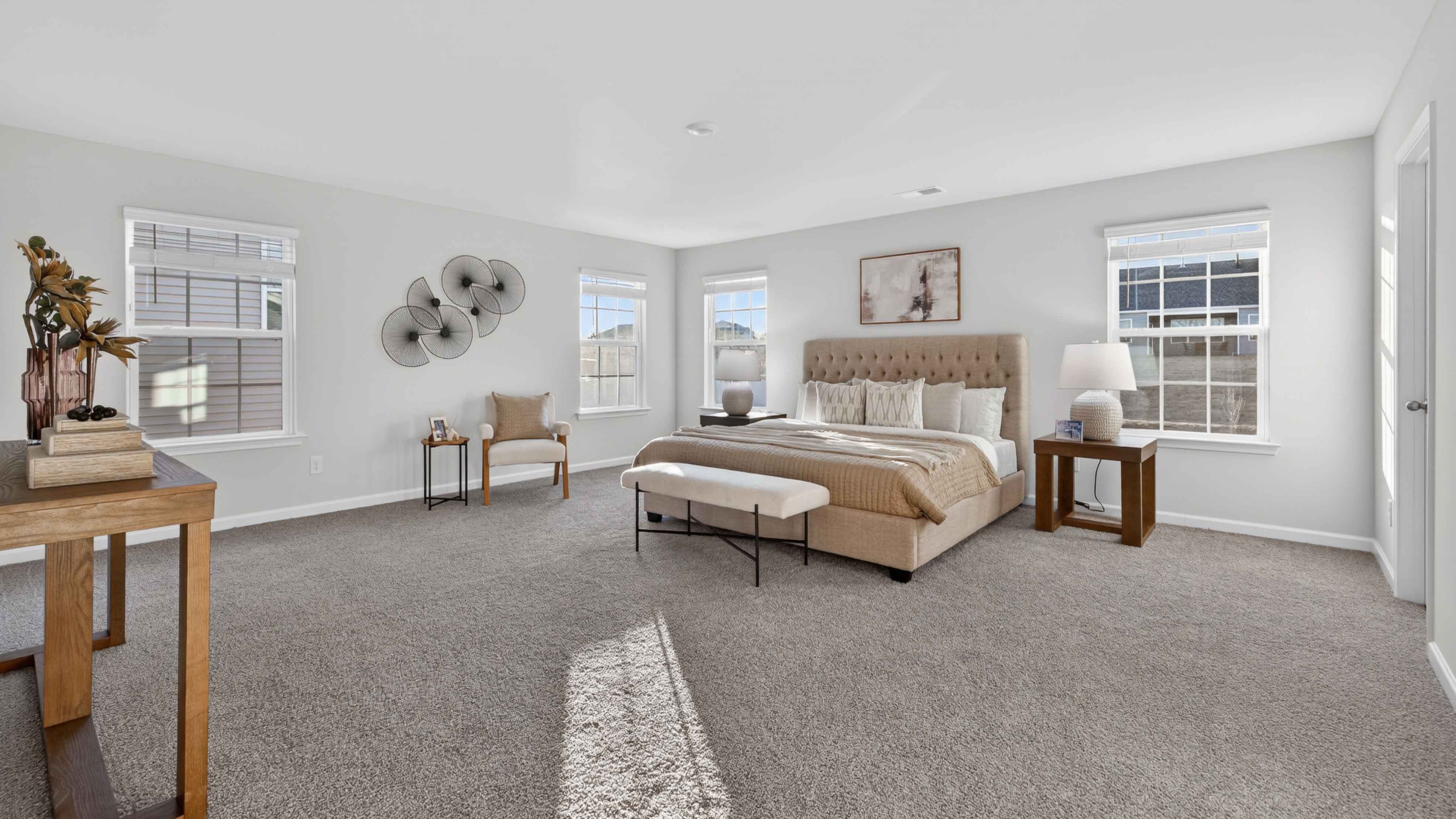 Carpeted bedroom with large window