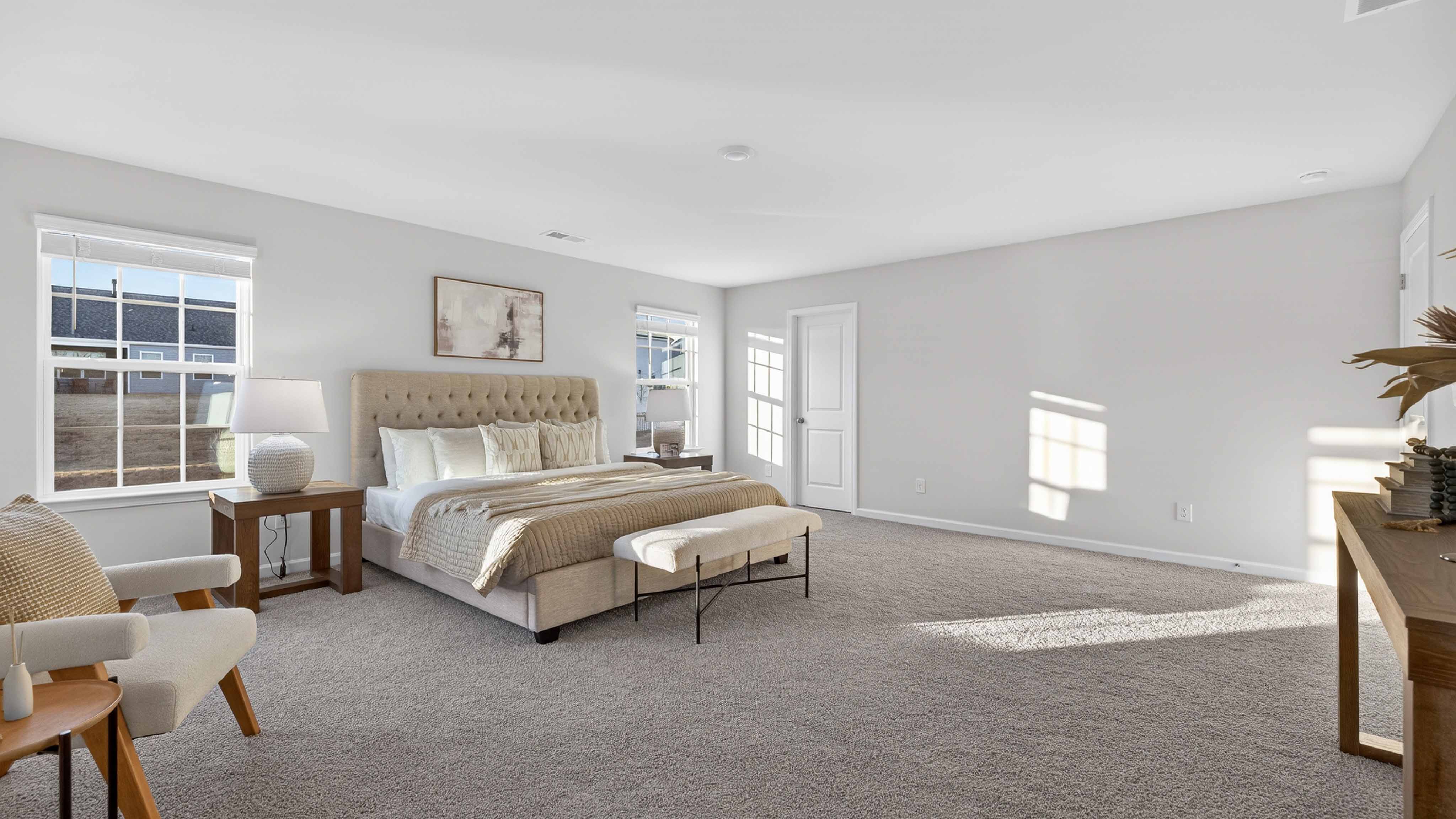 Carpeted bedroom with large window