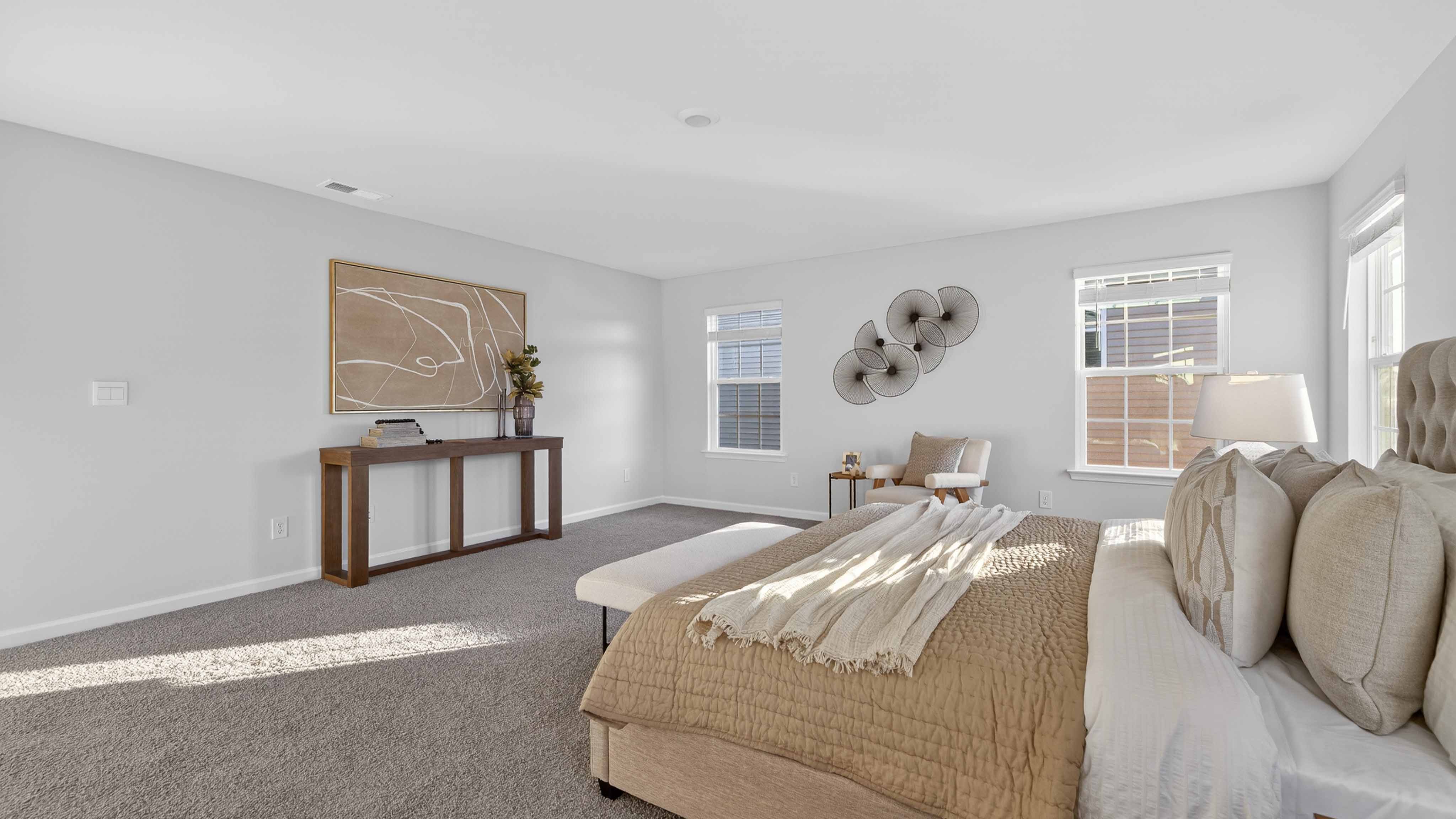 Carpeted bedroom with large window