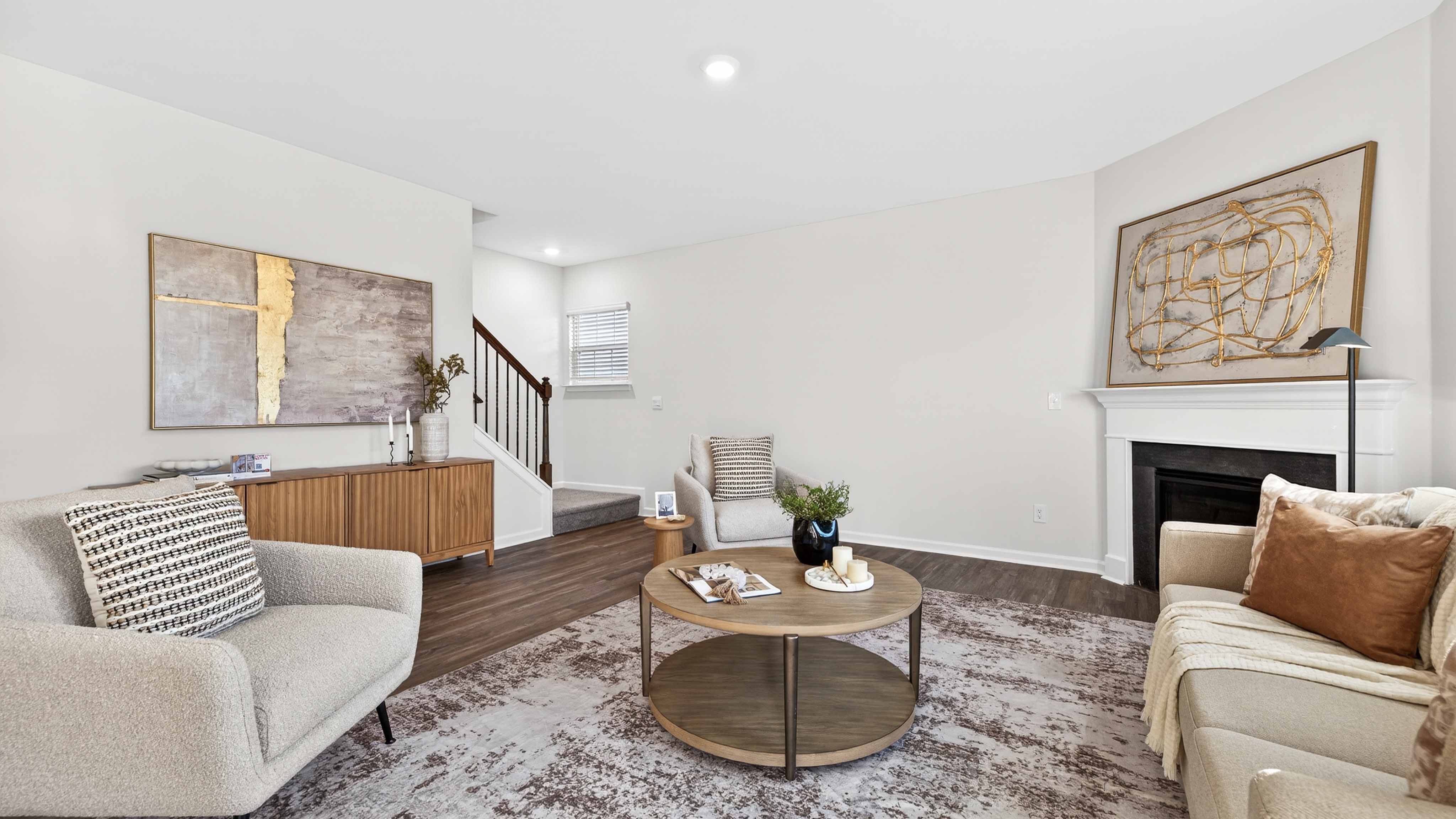 Spacious family room with large window and fireplace