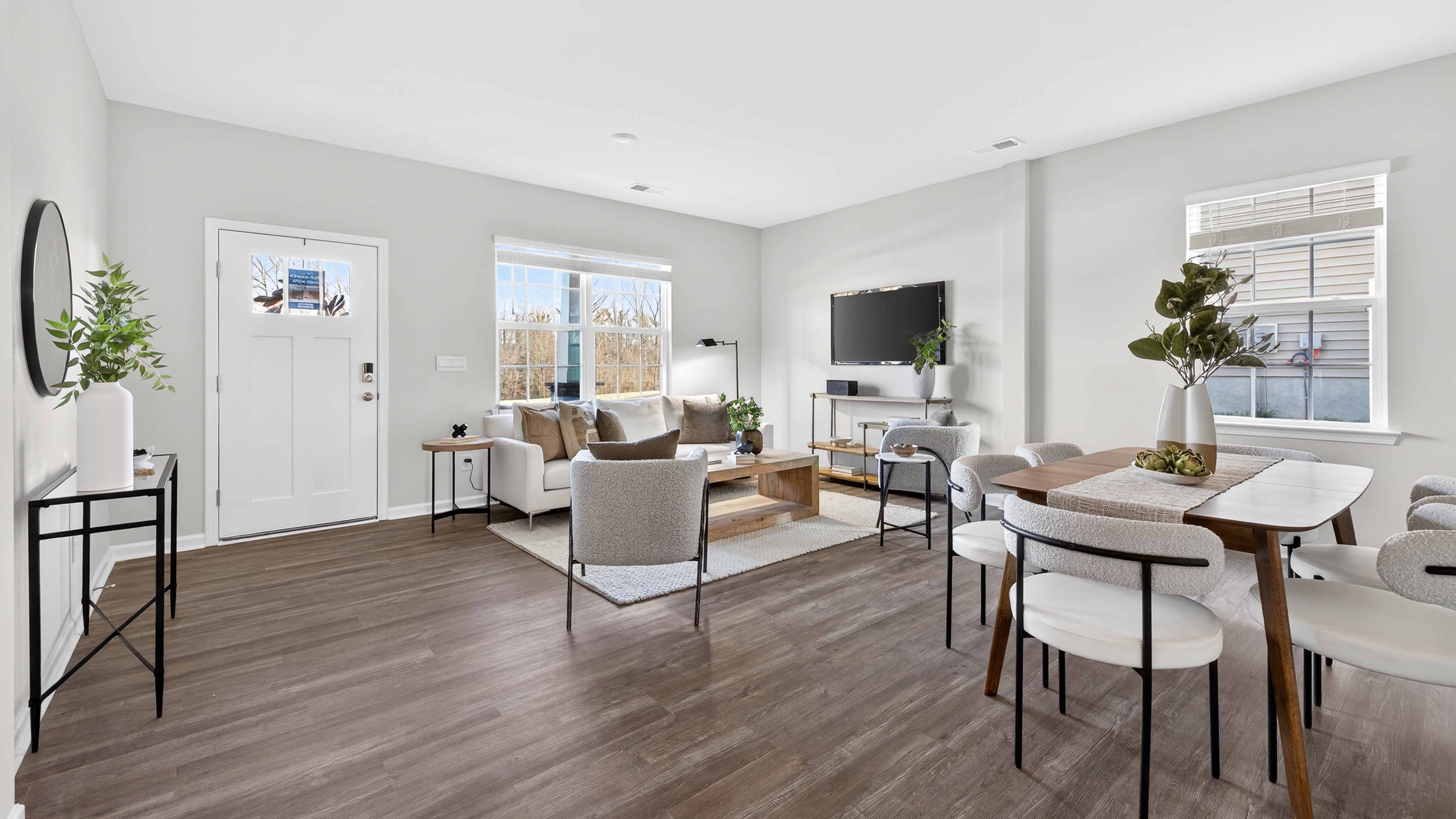 Spacious family room with large window and fireplace