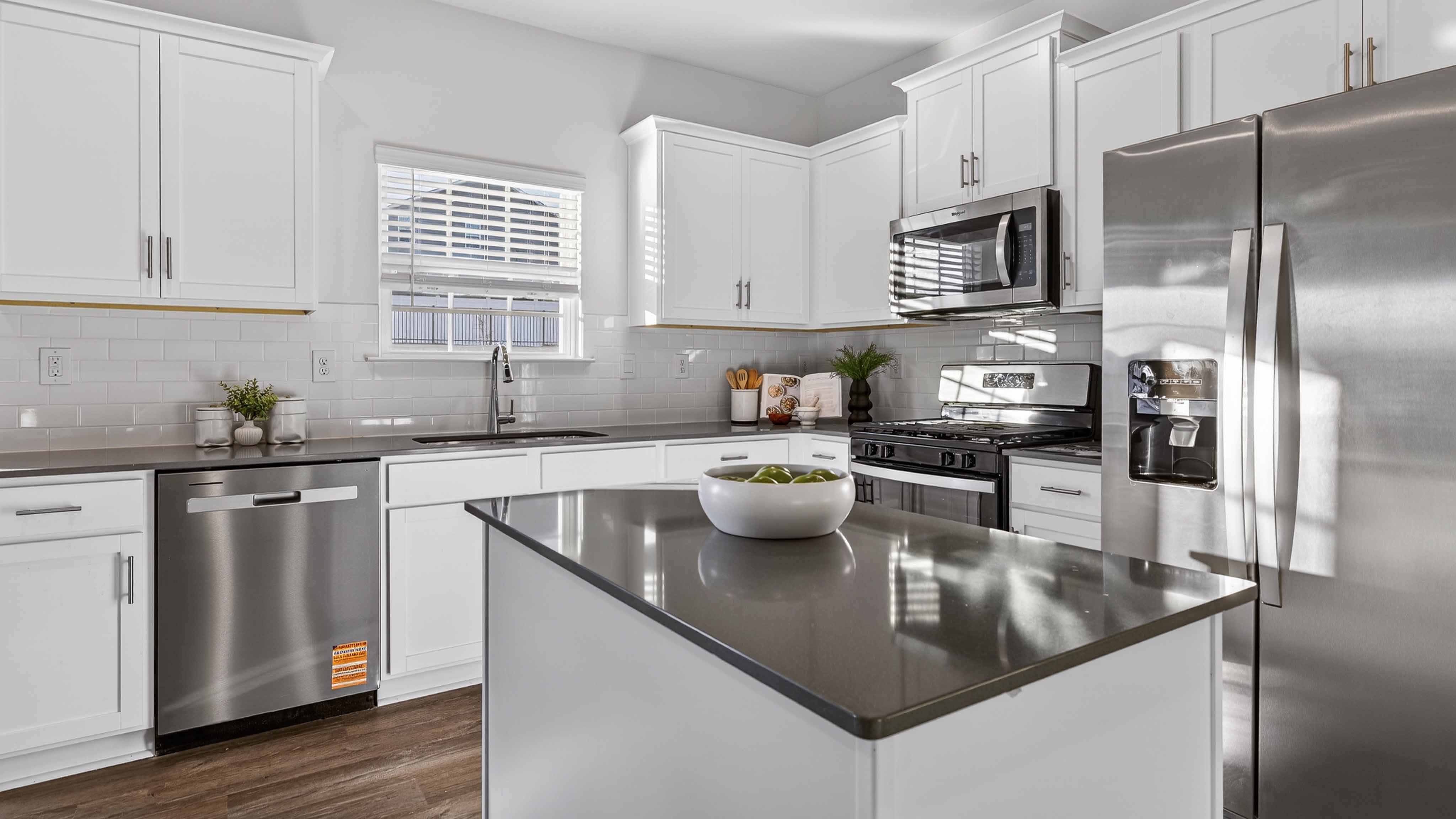 Kitchen with island, white cabinets