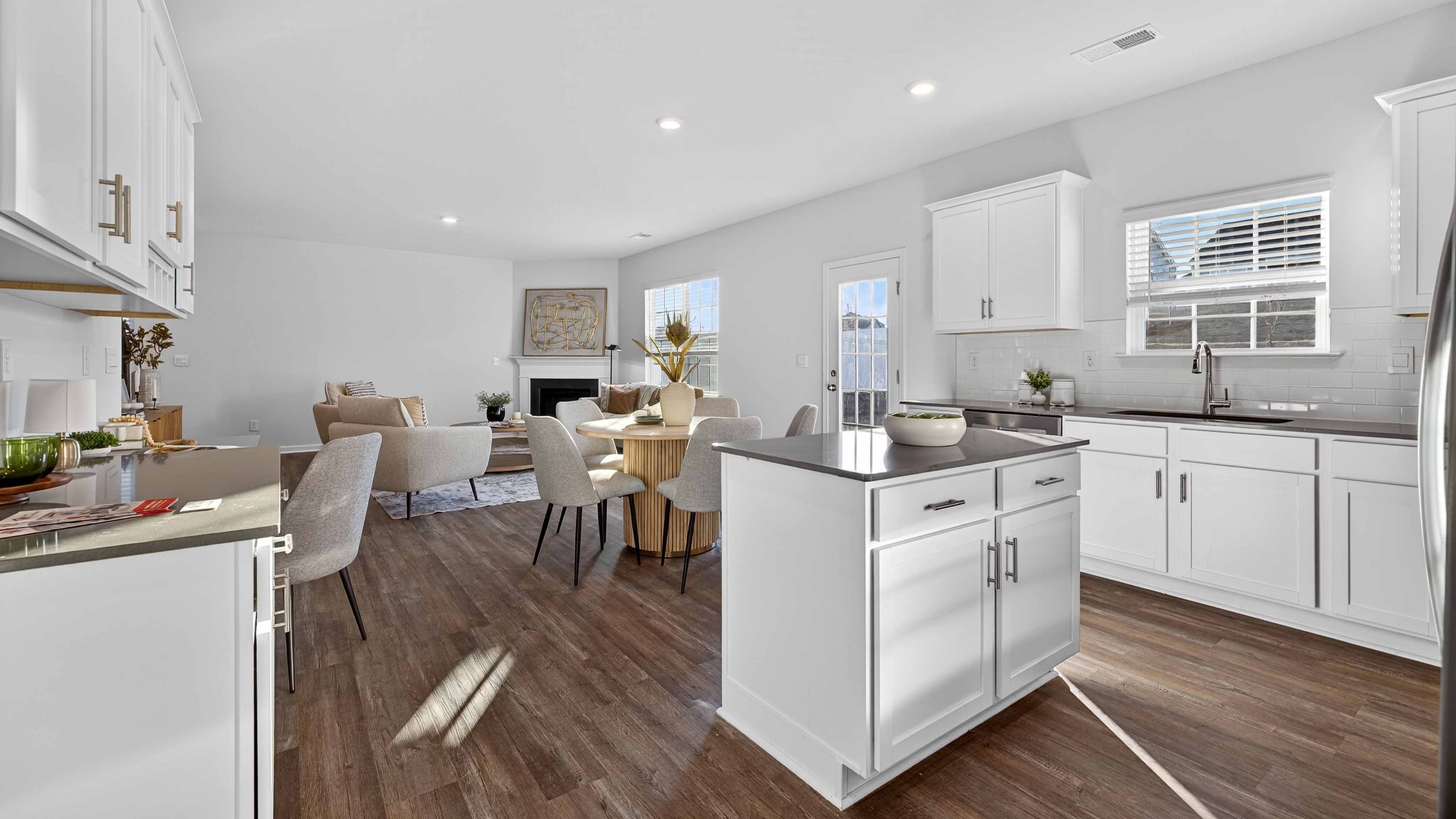 Kitchen with island, white cabinets
