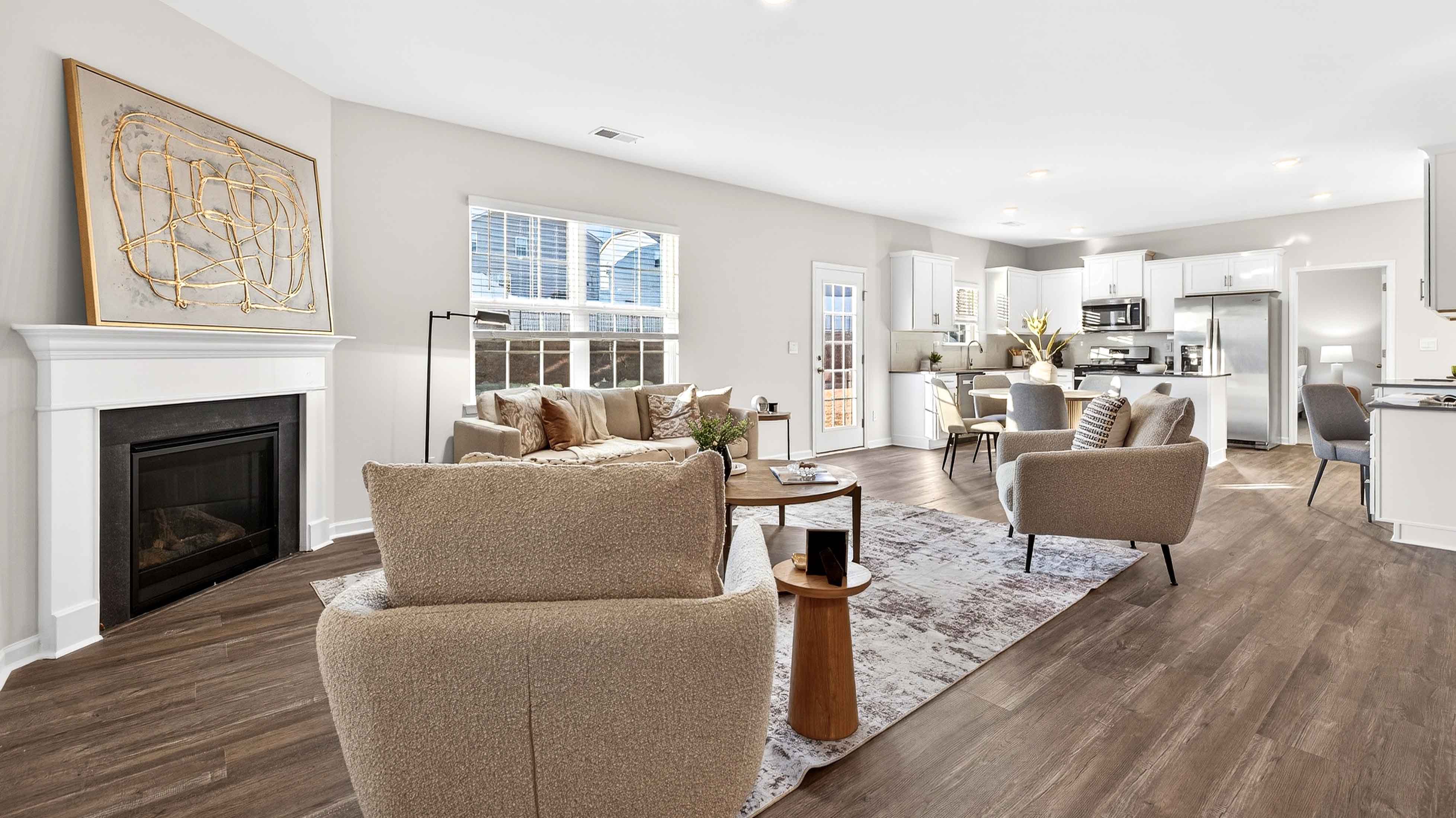 Spacious family room with large window and fireplace